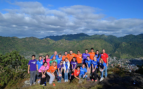 Group of volunteers in front of a mountain vista